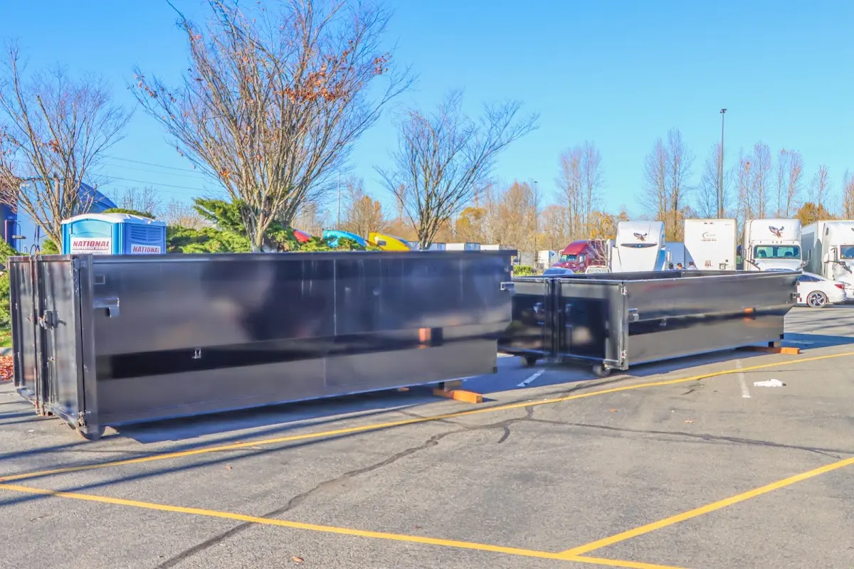 Professional dumpster rental service with roll-off container on residential driveway in Sierra Vista